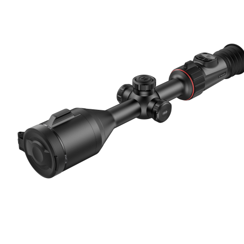 De Nocpix ACE S60R is een zwarte richtkijker met een cilindrisch ontwerp, met verstelknoppen en een getextureerde grip. Hij heeft een matte afwerking met rode accenten en is diagonaal op een witte achtergrond geplaatst.